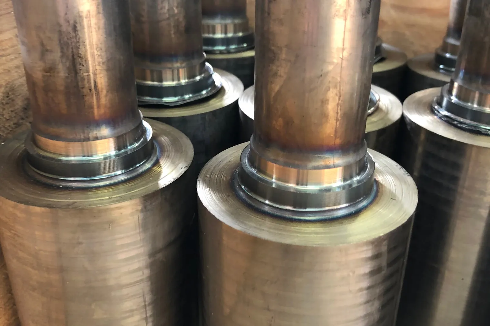Welded tubes in a row, with the flash left at the joint
